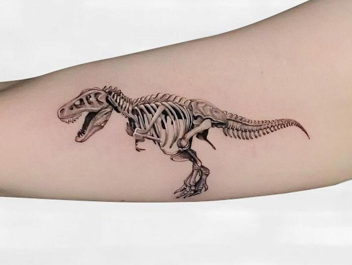 #31 T-Rex Skeleton #1 Very Colorful Dinosaur, #2 White Stegosaurus Fossil, #4 A Blind Cat Walking His Guiding Velociraptor, #6 Dinosaur Bubble Bath, #7 Dinosaur Sleeve, #8 Gorgeous Work, #9 My Favorite, #10 Ok Google, #11 Furry Little Dinosaur, #12 Super Cute Dino, #13 Siblings' Tattoos, #14 Does Everyone Like Geometric Art? T-Rex Skull, #16 Tattoo Museum, #18 Jungle Dinosaur, #19 Origami T-Rex, #20 My Cartoon Dinosaurs' Tattoo, #21 Dino With Underwater Scene, #22 I Bet This Tea Comes With A Very Special Flavor, #23 Hand-Poked Dinosaur, #24 Yehaaaw, #25 Punk Raptor, #26 Dinos Love Donuts, #27 First Tattoo, #28 Basquiat Dino, #29 We All Live In A Submarine, #30 Raptor. Really Amazing Work, #31 T-Rex Skeleton, #32 Aliens vs. Dinosaurs, #33 T-Rex, #35 Dinosaur Tattoo For Gamers, #37 Uncle Brachiosaurus With His Nephew, #38 Velociraptor, #39 This T-Rex Done By Me, #40 This Guy Is My Neighbor, #41 Dinosaur Sleeve, #42 Walking A T-Rex, #43 Color Realism Velociraptor. Work In Progress, #44 Dinosaur And A Warrior, #46 Just A Man And His Dino