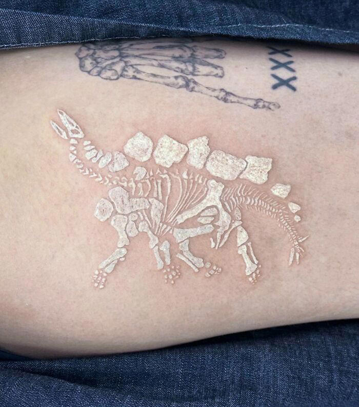 #2 White Stegosaurus Fossil #1 Very Colorful Dinosaur, #2 White Stegosaurus Fossil, #4 A Blind Cat Walking His Guiding Velociraptor, #6 Dinosaur Bubble Bath, #7 Dinosaur Sleeve, #8 Gorgeous Work, #9 My Favorite, #10 Ok Google, #11 Furry Little Dinosaur, #12 Super Cute Dino, #13 Siblings' Tattoos, #14 Does Everyone Like Geometric Art? T-Rex Skull, #16 Tattoo Museum, #18 Jungle Dinosaur, #19 Origami T-Rex, #20 My Cartoon Dinosaurs' Tattoo, #21 Dino With Underwater Scene, #22 I Bet This Tea Comes With A Very Special Flavor, #23 Hand-Poked Dinosaur, #24 Yehaaaw, #25 Punk Raptor, #26 Dinos Love Donuts, #27 First Tattoo, #28 Basquiat Dino, #29 We All Live In A Submarine, #30 Raptor. Really Amazing Work, #31 T-Rex Skeleton, #32 Aliens vs. Dinosaurs, #33 T-Rex, #35 Dinosaur Tattoo For Gamers, #37 Uncle Brachiosaurus With His Nephew, #38 Velociraptor, #39 This T-Rex Done By Me, #40 This Guy Is My Neighbor, #41 Dinosaur Sleeve, #42 Walking A T-Rex, #43 Color Realism Velociraptor. Work In Progress, #44 Dinosaur And A Warrior, #46 Just A Man And His Dino