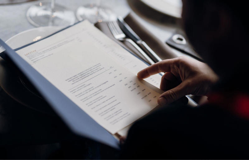 6. Burying prices 28. Handwritten checks, 27. The color red, 26. Going big on carbs, 25. Free items for online reviews, 24. Tempting you with dessert, 23. Not offering tap water, 22. Deliberately making seating comfortable (or uncomfortable), 21. The use of smell, 20. Words not numbers, 19. A raw deal for vegetarians and vegans, 18. Loyalty schemes, 17. Soft launch pricing, 16. Homing in on nostalgia, 15. Fluffy menu descriptions, 14. ‘Enjoy a drink at the bar first’, 13. Menu photos, 12. Side dish overload, 11. The choice of music, 10. Encourage the use of self-service kiosks, 9. Dropping the currency symbol, 8. Enticing deals, 7. The rise of small plates, 6. Specials boards, 5. Burying prices, 4. Odd-numbered portions, 3. Menu engineering, 2. Absurdly priced dishes