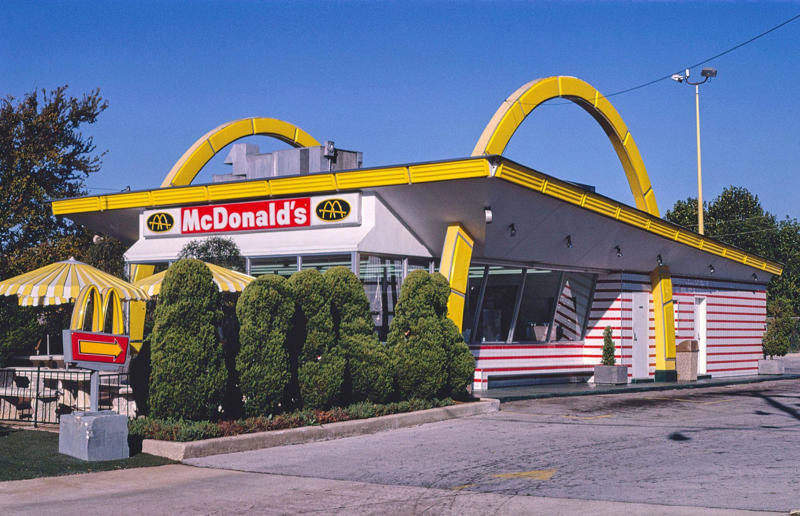 Golden exterior In pictures: McDonald's in the 1980s, Old-school signage, Differing styles, A move towards simpler signs, A slice of history, Golden exterior, The same, but different, Striking appearances, The rise of the drive-thru, A change in (exterior) pace, City branches, Outdoor space aplenty, Endless fun for kids, A place to hang out, Busy preparation areas, Recycling systems, Menu highlights, Item checklist, The Chicken McNuggets phenomenon, Coupon craze, McDonald’s in Tokyo, Japan, Menus in Tokyo, Japan, Global openings, Colourful uniforms, Service with a smile, Mascots were everywhere, A push for evening meals, Royal window displays, Esteemed guests, Presidential visits