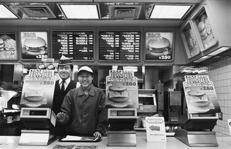 McDonald’s in Tokyo, Japan In pictures: McDonald's in the 1980s, Old-school signage, Differing styles, A move towards simpler signs, A slice of history, Golden exterior, The same, but different, Striking appearances, The rise of the drive-thru, A change in (exterior) pace, City branches, Outdoor space aplenty, Endless fun for kids, A place to hang out, Busy preparation areas, Recycling systems, Menu highlights, Item checklist, The Chicken McNuggets phenomenon, Coupon craze, McDonald’s in Tokyo, Japan, Menus in Tokyo, Japan, Global openings, Colourful uniforms, Service with a smile, Mascots were everywhere, A push for evening meals, Royal window displays, Esteemed guests, Presidential visits