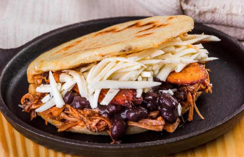 90. Peri peri chicken, Mozambique, 89. Sauerbraten, Germany, 88. Massaman, Thailand, 87. Spanakopita, Cyprus and Greece, 86. Cassoulet, France, 85. Banitsa, Bulgaria, 84. Barramundi, Australia, 83. Pastel de choclo, Chile, 82. Mole, Mexico, 81. Borscht, Ukraine, 80. Plov, Uzbekistan, 79. Bunny chow, South Africa, 78. Käsespätzle/ Käsknöpfle, Central Europe, 77. Chicken rice, Singapore, 76. Adobo, Philippines, 75. Rösti, Switzerland, 74. Falafel, Middle East, 73. Hoppers, Sri Lanka, 72. Nasi lemak, Malaysia, 71. Pupusa, El Salvador, 70. Beef rendang, Indonesia, 69. Tortilla de patatas, Spain, 68. French onion soup, France, 67. Colcannon, Ireland, 66. Bobotie, South Africa, 65. Haggis, Scotland, 64. Tamales, Central and South America, 63. Wiener schnitzel, Austria, 62. Feijoada, Brazil, 61. Souvlaki, Greece, 60. Laksa, Malaysia, 59. Clam chowder, USA, 58. Raclette, Switzerland, 57. Smørrebrød, Denmark, 56. Jollof rice, West Africa, 55. Poutine, Canada, 54. Goulash, Hungary, 53. Pho, Vietnam, 52. Biryani, India, 51. Arepa, Colombia and Venezuela, 50. Shawarma, Middle East, 49. Beef stroganoff, Russia, 48. Som tam, Laos, 47. Cacio e pepe, Italy, 46. Bouillabaisse, France, 45. Khachapuri, Georgia, 44. Ceviche, Peru, 43. Quesadilla, Mexico, 42. Masala dosa, India, 41. Moules frites, Belgium, 40. Köttbullar, Sweden, 39. Welsh rarebit, Wales, 38. Pierogi, Poland, 37. Poke, USA, 36. Tagine, Morocco, 35. Dim sum, China, 34. Gumbo, USA, 33. Kebab, Turkey, 32. Jerk chicken, Jamaica, 31. Singapore noodles, Hong Kong, 30. Asado, Argentina, 29. Beef Wellington, England, 28. Moussaka, Greece, 27. Tahdig, Iran, 26. Murgh makhani, India, 25. Gnocchi, Italy, 24. Sushi, Japan, 23. Texas-style barbecue, USA, 22. Fish and chips, UK, 21. Carbonara, Italy, 20. Tom yum soup, Thailand, 19. Cataplana, Portugal, 18. Mezze, Middle East, 17. Pad Thai, Thailand, 16. Steak frites, France, 15. Shakshuka, Middle East, 14. Tapas, Spain, 13. Gua bao, Taiwan, 12. Boeuf bourguignon, France, 11. Peking duck, China, 10. Chicken parmigiana, USA, 9. Bibimbap, South Korea, 8. Paella, Spain, 7. Tacos, Mexico, 6. Southern fried chicken, USA, 5. Sausage and mash, UK, 4. Ragù alla Bolognese, Italy, 3. Ramen, Japan, 2. Hamburger, USA