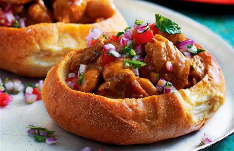 90. Peri peri chicken, Mozambique, 89. Sauerbraten, Germany, 88. Massaman, Thailand, 87. Spanakopita, Cyprus and Greece, 86. Cassoulet, France, 85. Banitsa, Bulgaria, 84. Barramundi, Australia, 83. Pastel de choclo, Chile, 82. Mole, Mexico, 81. Borscht, Ukraine, 80. Plov, Uzbekistan, 79. Bunny chow, South Africa, 78. Käsespätzle/ Käsknöpfle, Central Europe, 77. Chicken rice, Singapore, 76. Adobo, Philippines, 75. Rösti, Switzerland, 74. Falafel, Middle East, 73. Hoppers, Sri Lanka, 72. Nasi lemak, Malaysia, 71. Pupusa, El Salvador, 70. Beef rendang, Indonesia, 69. Tortilla de patatas, Spain, 68. French onion soup, France, 67. Colcannon, Ireland, 66. Bobotie, South Africa, 65. Haggis, Scotland, 64. Tamales, Central and South America, 63. Wiener schnitzel, Austria, 62. Feijoada, Brazil, 61. Souvlaki, Greece, 60. Laksa, Malaysia, 59. Clam chowder, USA, 58. Raclette, Switzerland, 57. Smørrebrød, Denmark, 56. Jollof rice, West Africa, 55. Poutine, Canada, 54. Goulash, Hungary, 53. Pho, Vietnam, 52. Biryani, India, 51. Arepa, Colombia and Venezuela, 50. Shawarma, Middle East, 49. Beef stroganoff, Russia, 48. Som tam, Laos, 47. Cacio e pepe, Italy, 46. Bouillabaisse, France, 45. Khachapuri, Georgia, 44. Ceviche, Peru, 43. Quesadilla, Mexico, 42. Masala dosa, India, 41. Moules frites, Belgium, 40. Köttbullar, Sweden, 39. Welsh rarebit, Wales, 38. Pierogi, Poland, 37. Poke, USA, 36. Tagine, Morocco, 35. Dim sum, China, 34. Gumbo, USA, 33. Kebab, Turkey, 32. Jerk chicken, Jamaica, 31. Singapore noodles, Hong Kong, 30. Asado, Argentina, 29. Beef Wellington, England, 28. Moussaka, Greece, 27. Tahdig, Iran, 26. Murgh makhani, India, 25. Gnocchi, Italy, 24. Sushi, Japan, 23. Texas-style barbecue, USA, 22. Fish and chips, UK, 21. Carbonara, Italy, 20. Tom yum soup, Thailand, 19. Cataplana, Portugal, 18. Mezze, Middle East, 17. Pad Thai, Thailand, 16. Steak frites, France, 15. Shakshuka, Middle East, 14. Tapas, Spain, 13. Gua bao, Taiwan, 12. Boeuf bourguignon, France, 11. Peking duck, China, 10. Chicken parmigiana, USA, 9. Bibimbap, South Korea, 8. Paella, Spain, 7. Tacos, Mexico, 6. Southern fried chicken, USA, 5. Sausage and mash, UK, 4. Ragù alla Bolognese, Italy, 3. Ramen, Japan, 2. Hamburger, USA