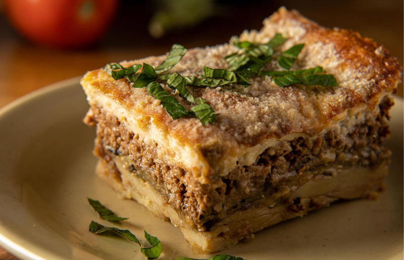 90. Peri peri chicken, Mozambique, 89. Sauerbraten, Germany, 88. Massaman, Thailand, 87. Spanakopita, Cyprus and Greece, 86. Cassoulet, France, 85. Banitsa, Bulgaria, 84. Barramundi, Australia, 83. Pastel de choclo, Chile, 82. Mole, Mexico, 81. Borscht, Ukraine, 80. Plov, Uzbekistan, 79. Bunny chow, South Africa, 78. Käsespätzle/ Käsknöpfle, Central Europe, 77. Chicken rice, Singapore, 76. Adobo, Philippines, 75. Rösti, Switzerland, 74. Falafel, Middle East, 73. Hoppers, Sri Lanka, 72. Nasi lemak, Malaysia, 71. Pupusa, El Salvador, 70. Beef rendang, Indonesia, 69. Tortilla de patatas, Spain, 68. French onion soup, France, 67. Colcannon, Ireland, 66. Bobotie, South Africa, 65. Haggis, Scotland, 64. Tamales, Central and South America, 63. Wiener schnitzel, Austria, 62. Feijoada, Brazil, 61. Souvlaki, Greece, 60. Laksa, Malaysia, 59. Clam chowder, USA, 58. Raclette, Switzerland, 57. Smørrebrød, Denmark, 56. Jollof rice, West Africa, 55. Poutine, Canada, 54. Goulash, Hungary, 53. Pho, Vietnam, 52. Biryani, India, 51. Arepa, Colombia and Venezuela, 50. Shawarma, Middle East, 49. Beef stroganoff, Russia, 48. Som tam, Laos, 47. Cacio e pepe, Italy, 46. Bouillabaisse, France, 45. Khachapuri, Georgia, 44. Ceviche, Peru, 43. Quesadilla, Mexico, 42. Masala dosa, India, 41. Moules frites, Belgium, 40. Köttbullar, Sweden, 39. Welsh rarebit, Wales, 38. Pierogi, Poland, 37. Poke, USA, 36. Tagine, Morocco, 35. Dim sum, China, 34. Gumbo, USA, 33. Kebab, Turkey, 32. Jerk chicken, Jamaica, 31. Singapore noodles, Hong Kong, 30. Asado, Argentina, 29. Beef Wellington, England, 28. Moussaka, Greece, 27. Tahdig, Iran, 26. Murgh makhani, India, 25. Gnocchi, Italy, 24. Sushi, Japan, 23. Texas-style barbecue, USA, 22. Fish and chips, UK, 21. Carbonara, Italy, 20. Tom yum soup, Thailand, 19. Cataplana, Portugal, 18. Mezze, Middle East, 17. Pad Thai, Thailand, 16. Steak frites, France, 15. Shakshuka, Middle East, 14. Tapas, Spain, 13. Gua bao, Taiwan, 12. Boeuf bourguignon, France, 11. Peking duck, China, 10. Chicken parmigiana, USA, 9. Bibimbap, South Korea, 8. Paella, Spain, 7. Tacos, Mexico, 6. Southern fried chicken, USA, 5. Sausage and mash, UK, 4. Ragù alla Bolognese, Italy, 3. Ramen, Japan, 2. Hamburger, USA
