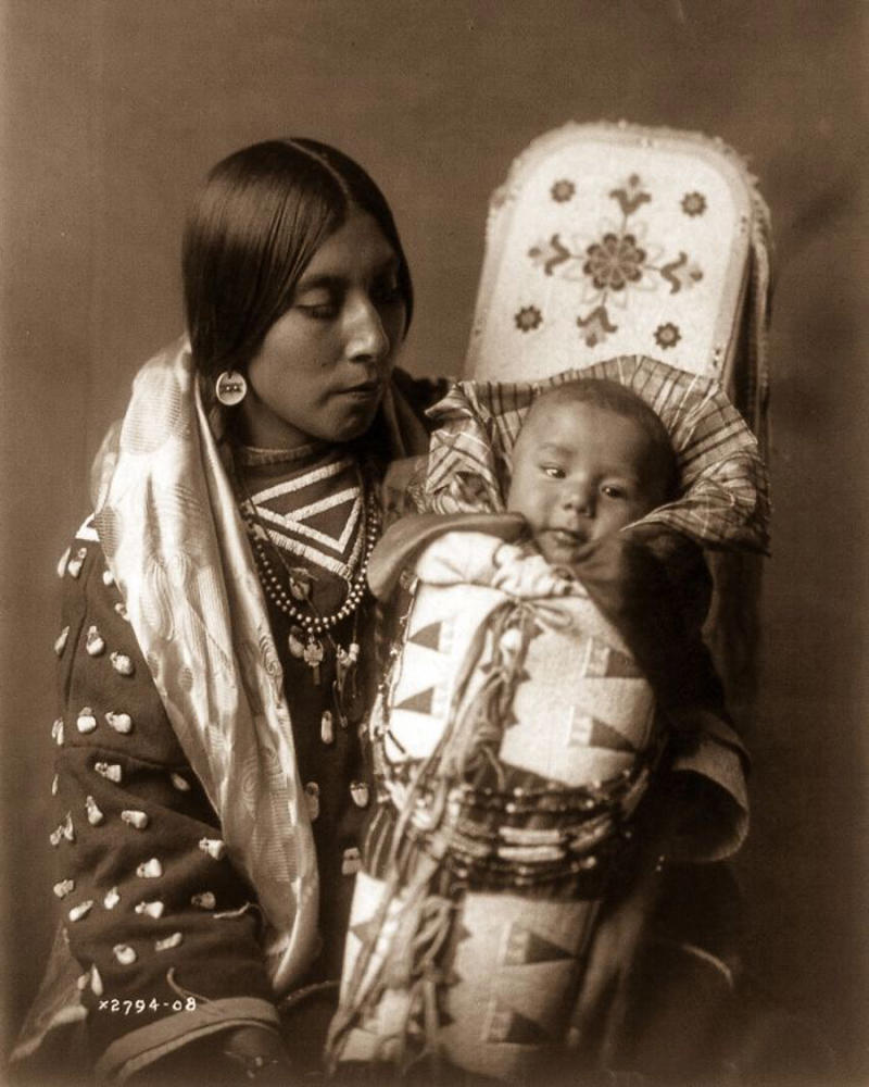 #5 An Apsaroke Mother And Child, 1908 #1 A Klamath Chief Stands On A Hill Above Crater Lake, Oregon, 1923, #3 A Jicarrilla Girl, C. 1910, #5 An Apsaroke Mother And Child, 1908, #7 A Tewa Girl, 1906, #9 Piegan Tepees, 1910, #11 Mohave Woman, 1903, #13 A Kwakiutl Wedding Party Arrives In Canoes, 1914, #15 Eskadi, Of The Apache Tribe, 1903, #17 A Smoky Day At The Sugar Bowl, 1923, #19 Walpi Maidens, 1906, #21 Navajo Man, 1904, #23 Navajos, 1905, #25 Piegan Girls Gather Goldenrod, 1910, #27 A Hidatsa Man With A Captured Eagle, 1908, #29 Hakalahl, A Nakoaktok Chief, 1914, #31 A Young Member Of The Apache Tribe, C. 1910, #33 Apsaroke Man Wearing Medicine Hawk Headdress, 1908, #35 A Kwakiutl Gatherer Hunts Abalones In Washington, 1910, #37 Kwakiutl People In Canoes In British Columbia, 1914, #39 A Cahuilla Woman, 1924, #41 Members Of The Qagyuhl Tribe Dance To Restore An Eclipsed Moon, C. 1910, #43 Iahla, Also Known As "willow," Of The Taos Pueblo, 1905, #45 A Kutenai Duck Hunter, 1910, #47 A Hupa Woman, 1923, #49 A Maricopa Woman, 1907, #51 Spearing Salmon, 1923, #53 Nayenezgani, A Navajo Man, 1904, #55 A Zuni Woman, 1903, #57 Hopi Bridal Costume, 1900, #59 A Maricopa Woman With Arrow-brush Stalks, 1907, #61 At The Old Well Of Acoma, 1904, #63 A Kwakiutl Shaman, 1914, #65 An Apache Woman Reaps Grain, C. 1910, #67 A Sioux Hunter, 1905, #69 Piegan Chiefs, 1900, #71 Mnainak, A Yakima Chief, 1910