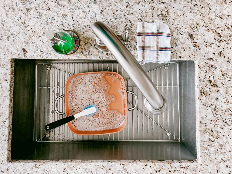 14) Tackle Build-up on Pots and Pans 1) Clean a Cutting Board, 2) Refresh Your Oven Door, 3) Deodorize a Garbage Disposal, 4) Polish Glassware, 5) Make an Air Freshener, 7) Shine Metal, 10) Wipe Down Your Stovetop, 11) Fix Stained Containers, 13) Clean a Cheese Grater, 14) Tackle Build-up on Pots and Pans