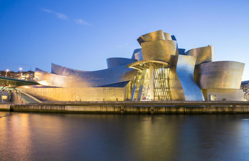 18. Sagrada Familia, Barcelona, Spain, 17. Notre-Dame Basilica, Montreal, Quebec, Canada, 16. The Flatiron, New York City, New York, USA, 15. St Pancras Renaissance Hotel, London, England, UK, 14. Burj Al Arab, Dubai, UAE, 13. The Guggenheim, Bilbao, Spain, 12. Pena Palace, Sintra, Portugal, 11. Neuschwanstein Castle, Bavaria, Germany, 10. Wat Rong Khun, Chiang Rai, Thailand, 9. Hallgrimskirkja, Reykjavík, Iceland, 8. Sydney Opera House, Sydney, New South Wales, Australia, 7. Osaka Castle, Osaka, Japan, 6. Palace of Versailles, Versailles, France, 5. Cologne Cathedral, Cologne, Germany, 4. The Tiger's Nest, Bhutan, 3. Duomo di Milano, Milan, Italy, 2. Taj Mahal, Agra, India, 1. Mont-Saint-Michel, Normandy, France