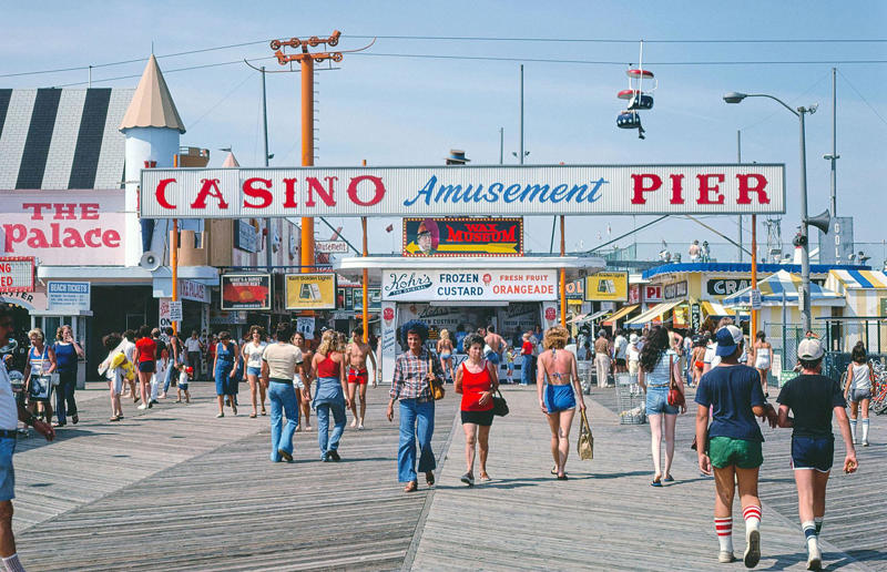 New Jersey: Seaside Heights boardwalk (1978) Life in the 1970s in every state, Alabama: Alabama Theatre, Birmingham (1972), Alaska: Fishing on Nonvianuk Lake (1973), Arizona: Route 66, Winslow (1979), Arkansas: Testing for pollution in Fort Smith (1973), California: The streets of San Francisco (c.1970), Colorado: Galena Street, Aspen (1974), Connecticut: Collin’s Diner, Canaan (1976), Delaware: Old State House, Dover (1970), Florida: Disney’s Magic Kingdom (1970), Georgia: Farmer ploughing field in Helen (1970), Hawaii: The Brady Bunch in ‘Hawaii Bound’ (1972), Idaho: Camping on Lake Stanley (c.1970s), Illinois: Roller Disco fashion show, Chicago (1979), Indiana: Indianapolis 500 (1973), Iowa: Sergeant John F. Baker Jr. Bridge, Davenport (1972), Kansas: Grain elevator, White Cloud (1974), Kentucky: Miners’ homes, Brookside (1974), Louisiana: Bourbon Street, New Orleans (1976), Maine: Fishing in Cape Elizabeth (1971), Maryland: School excursion to Baltimore harbor (1973), Massachusetts: Haymarket Square, Boston (1973), Michigan: Annual smelt run, Tawas City (1973), Minnesota: SkyRise Terrace, St Paul (1971), Mississippi: Hurricane Camille Gift Shop, Gulfport (1979), Missouri: Tourist information booth, Lake of the Ozarks, Montana: East Glacier Park train station (1974), Nebraska: Sioux tribal dance, North Platte (1970), Nevada: Fremont Street, Las Vegas (c.1970), New Hampshire: Waterville Valley (1972), New Jersey: Seaside Heights boardwalk (1978), New Mexico: Mesa viewpoint (c.1970s), New York: Sightseeing cruise, New York City (c.1970s), North Carolina: Prom queen parade, Huntersville (c.1970s), North Dakota: Arriving at Fargo station (c.1972), Ohio: Aerial view of Toledo (c.1970s), Oklahoma: Oral Roberts University, Tulsa (c.1977), Oregon: Union Station, Portland (1974), Pennsylvania: Street parade, Philadelphia (1976), Rhode Island: Giant milk can, Lincoln (1978), South Carolina: Jungle Golf, Myrtle Beach (1979), South Dakota: Reptile Gardens Wild Animal Park (1975), Tennessee: Interstate 24 near Nashville (1972), Texas: Dallas freeway (1970), Utah: Dead Horse Point, Canyonlands (1972), Vermont: Farm shop (1975), Virginia: Tysons Corner Mall, Tysons Corner (1976), Washington: Seattle skyline (1973), West Virginia: Laundromat, Cedar Grove (1973), Wisconsin: Lake Mendota (1979)