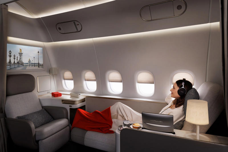 Reclining seats included footrests and leaned almost all the way back., The first-class cabin's gourmet dining remained., Flutes of Champagne were an added bonus., Spiral staircases led to the 747's upper deck lounge., Some early jumbo jets were even equipped with pianos., The massive double-decker entered service with Singapore Airlines in 2007., Two suites could even be merged to create a couple's suite., Emirates has also launched its own first-class suites., Amenities include access to an in-flight shower., However, the ultimate first-class experience comes courtesy of Etihad., Each 125-square-foot, three-room suite features an en suite bathroom with a shower., It also includes a private bedroom and a personal butler., Two suites can be joined to create a two-passenger mega-suite.