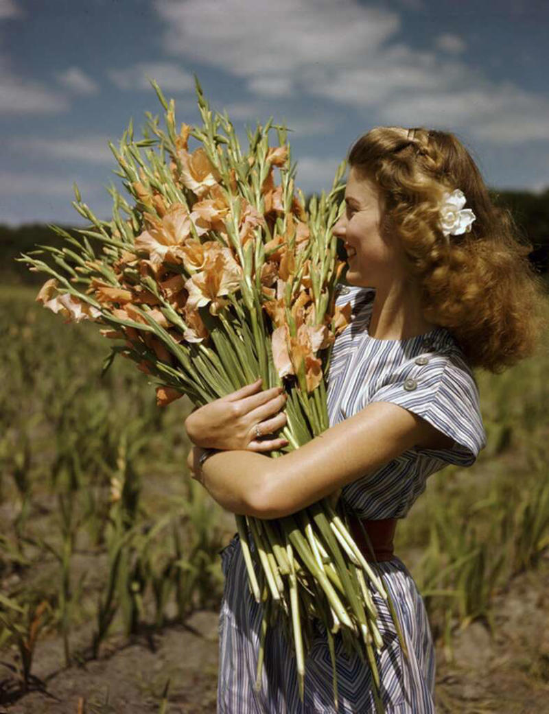 1. "Three boys, including my grandfather (right), find a missing child in a corn field after a town-wide, day-long search in 1942.", 2. "Six-year-old Richard Baranski after winning a contest by eating a 10-inch cranberry pie in 15 seconds in 1948.", 3. "My Grandpa's mugshot when entering a WWII POW camp in the 1940s.", 4. Woman holding a bundle of fresh-picked gladiolus flowers at Terra Ceia Island, Florida, 5. "Here is my Grandma in the late 1940s on vacation.", 6. "A photograph I found hanging inside a small town diner from the 1940s.", 7. "Grand Central Station in 1941", 8. "Margaret Hamilton reuniting with her Wizard of Oz co-star on the set of Twin Beds (1942).", 9. "Disney artists study a deer for Bambi in 1942.", 10. "My weightlifter Great Grandpa holding my grandpa over his head in 1947.", 11. "I never realized Lucille Ball was so hot. Circa 1940s at a bowling alley.", 12. "Civil Air Patrol student pilot at the Silver Lake airfield near Baker, California in 1944.", 13. "My Grandpa selling melons from his car in 1941.", 14. A man begging for his wife's forgiveness inside a Divorce Court in Chicago, 1948, 15. "This was the 'Bicycle of the Future' in 1946", 16. "Two sailors sleeping off their celebration of the end of WWII in 1945.", 17. "The Zoot Suit in the 1940s", 18. Kids dancing in the street in NYC in the 1940s., 19. "A modeling photo of my Great Aunt Frizti (Frances), 1941", 20. "My Grandpa posing with his freshly caught sawfish in the 1940s.", 21. "Father passes out when he meets his triplets for the first time in 1946.", 22. "My Grandfather on my Grandmother's shoulders sometime in the 1940s.", 23. "My grandpa looked suave in the 1940s.", 24. "Southside Chicago, Easter 1941", 25. "Shirley Temple posing by a painting of young Shirley Temple in 1945.", 26. "Captain 'Waddy' Young and crew pose in front of their caricatures on their B-29 Superfortress on 11/24/44.", 27. "Robert De Niro aged three with his 24-year-old father Robert De Niro Sr. in 1946.", 28. "1946 mugshot of Paul Newman (age 21) after being arrested with five others for making trouble at Kenyon College.", 29. "Arctic explorer Peter Freuchen and his wife Dagmar Gale in 1947.", 30. "Sean Connery in the Royal Navy in 1946.", 31. "George Carlin on West 121st street, Manhattan, in 1947.", 32. "As soviet troops approached Berlin in 1945, citizens did their best to take care of Berlin Zoo's animals.", 33. "My Grandfather channeling the mafia at the Bronx Zoo in 1942.", 34. "A pig photo-bombing a wedding in the 1940s", 35. "Winston Churchill during a training day for D-Day circa 1944. Eisenhower is just there on his right on the firing line.", 36. "My grandma hanging out with Albert Einstein in her backyard around 1945.", 37. "Great Grandmother (on the right) in the 1940s in Cuba.", 38. "My grandmother with Sultan, her favorite lion from her troop, in front of her plane that she flew just after WWII in 1947.", 39. "WWII refugee children seeing the Statue of Liberty as they entered the United States in 1946.", 40. "Judy Garland and her daughter, Liza Minnelli, in 1947.", 41. "Babe Ruth and Yogi Berra in 1947.", 42. "Tuskegee airmen in Italy, 1945", 43. "My grandfather competing in motorcycle trials in 1947.", 44. "Military Police in Times Square on New Year's Eve, as 1941 turns to 1942.", 45. "Students in Brooklyn in 1945 protesting the 'no pants to school' rule.", 46. "My great aunt and her 'best friend' (girlfriend of 30+ years) working in the factory where they met in 1947.", 47. "A windy day in Philadelphia in 1947.", 48. "Size of the donut hole down through the years (1927-1948)", 49. "Two men at the NYC Greyhound Bust Terminal in 1947.", 50. My grandpa in 1948 looked like a total model.", 51. "Discovering the Mona Lisa after the end of WWII in 1945.", 52. "This impeccably dressed woman shopping for groceries with her son in 1945.", 53. "Young Ella Fitzgerald in 1945.", 54. "Royal Air Force pilot getting a haircut during a break between missions, Britain, 1942.", 55. "Two sharply dressed young men in Natchez, Mississippi in 1947.", 56. "My Grandmother for a photoshoot in Cuba circa 1940s", 57. "Teenagers at a party in Tula, Oklahoma in 1947.", 58. "Marilyn Monroe babysitting for a studio co-worker in 1947.", 59. "A bubble glass roof of a car in 1947.", 60. "Assembling the Sports Section of the New York Times in 1942", 61. "Boy watches TV for the first time from an appliance store window in 1948.", 62. "Woman wiring an early IBM computer in 1948.", 63. "Kids reading comics in NYC, 1947.", 64. "Native Americans win the right to register and vote in New Mexico, 1948.", 65. "My Grandma and Grandpa showing off the catch of the day in 1948.", 66. "My Grandpa and his dog in the early 1940s.", 67. "In the 1940s, men dressed in short shorts and cowboy boots serving women at a drive-in in Dallas.", 68. "My grandfather (left) and a friend in front of the Central Station Hamburg in 1948. He was a chimney sweep.", 69. "My great aunt and her 'special friend' in Nashville in the 1940s.", 70. "My grandfather with his puppy in 1948.", 71. "My grandparents the summer they met in 1948 while they were both working at the Glacier National Park.", 72. "Ukrainian women take up 'tommy-guns' for service in regular guerilla units in 1942.", 73. "Winter in Times Square, 1947.", 74. A curious Italian woman inspects the kilt of a Scottish soldier near the Coliseum after the liberation of Rome in 1944., 75. "My grandparents' honeymoon in Switzerland in 1946.", 76. "Drive-in movie theater in San Francisco in 1948.", 77. London in 1949, 78. "My grandparents who were high school sweethearts at Brighton Beach in 1948.", 79. "My Grandpa's worker ID from working the railroads in 1943.", 80. Trainees of the LAPS practice firing their new revolvers in 1948., 81. The stunningly beautiful Ava Gardner during the MGM employment questionnaire in 1942., 82. Betty White in 1949., 83. "Winnie the welder at the Richmond boatyard in 1943.", 84. "My grandma after she won a North American rollerskating championship in 1949.", 85. French woman pouring tea for a British soldier fighting in Normandy in 1944., 86. A U.S. soldier is trying on the Imperial Crown of the Holy Roman Empire, previously worn by every emperor between the 10th and 19th centuries. Circa 1945., 87. Five men pose for a 'selfie' using the reflection of a chrome hubcap. Taken in Paris in 1942., 88. Young couple on the subway in NYC in 1947., 89. Italian cyclist Gino Sciardis getting his bike lubricated during the 1949 Tour de France., 90. Street scene in Cascade, Idaho, in June 1941.