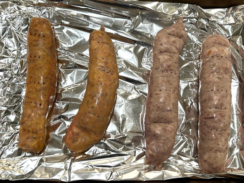 First, I preheated the oven to 350 degrees Fahrenheit and prepped the sausages. Ina Garten's orecchiette pasta features two types of sausage and broccoli rabe., First, I preheated the oven to 350 degrees Fahrenheit and prepped the sausages., After cooking the sausages for five minutes, I added the garlic., Then, it was time to add the tomatoes and wine.