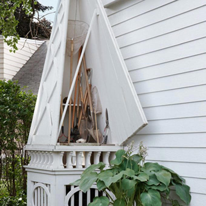 Hide AC Unit with a Living Garden AC Cover, Hide AC Unit with a Modern Outdoor AC Cover, AC Cover/Tool Shed, Hide AC Unit with Tall Shrubs, Hide AC Unit with Birdhouse Picket Fence, Hide AC Unit with a Shabby Chic Shutter Screen, Hide AC Unit with an Iron Trellis, Hide AC Unit with a Multi-Purpose Structure, Hide AC Unit with an Outdoor Privacy Screen