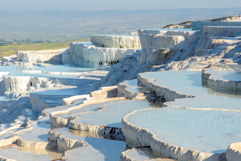 Ruskeala (Russia), Darvaza gas crater (Turkmenistan), Zhangye Danxia (China), Dark Hedges (Northern Ireland), Fly Geyser (United States), Blue Pond (Japan), Tunnel of Love (Ukraine), Las Médulas (Spain), Ojos del Salar (Chile), Hamilton Pool (United States), To Sua Ocean Trench (Samoa), Bryce Canyon (United States), Pamukkale (Turkey)