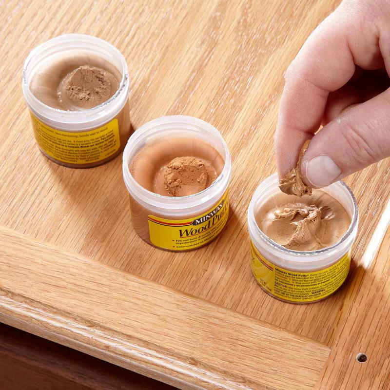 Mix Putty to Match 13 Tips To Install Cabinet Hardware Perfectly Every Time Gettyimages 1389698183 Ft, Use the Door Rail as a Guide, Hide Old Holes With Back Plates, Make a Simple Drawer Template, Two-Sided Templates Prevent Tear-Out, Use Thread Sealant to Keep the Screws Tight, Mix Putty to Match, Install Hardware Higher on the Lowest Drawer, Perfect Finish Touch-Ups