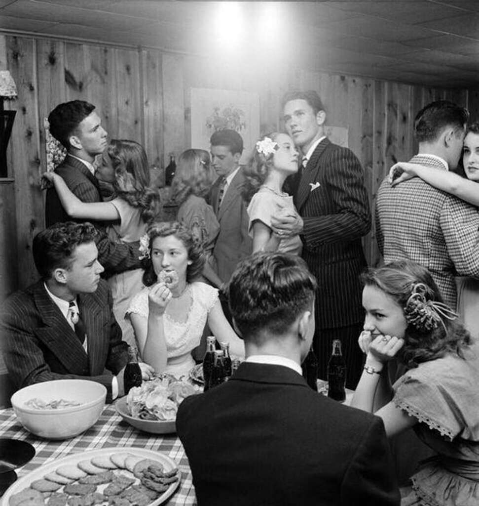 1. "Three boys, including my grandfather (right), find a missing child in a corn field after a town-wide, day-long search in 1942.", 2. "Six-year-old Richard Baranski after winning a contest by eating a 10-inch cranberry pie in 15 seconds in 1948.", 3. "My Grandpa's mugshot when entering a WWII POW camp in the 1940s.", 4. Woman holding a bundle of fresh-picked gladiolus flowers at Terra Ceia Island, Florida, 5. "Here is my Grandma in the late 1940s on vacation.", 6. "A photograph I found hanging inside a small town diner from the 1940s.", 7. "Grand Central Station in 1941", 8. "Margaret Hamilton reuniting with her Wizard of Oz co-star on the set of Twin Beds (1942).", 9. "Disney artists study a deer for Bambi in 1942.", 10. "My weightlifter Great Grandpa holding my grandpa over his head in 1947.", 11. "I never realized Lucille Ball was so hot. Circa 1940s at a bowling alley.", 12. "Civil Air Patrol student pilot at the Silver Lake airfield near Baker, California in 1944.", 13. "My Grandpa selling melons from his car in 1941.", 14. A man begging for his wife's forgiveness inside a Divorce Court in Chicago, 1948, 15. "This was the 'Bicycle of the Future' in 1946", 16. "Two sailors sleeping off their celebration of the end of WWII in 1945.", 17. "The Zoot Suit in the 1940s", 18. Kids dancing in the street in NYC in the 1940s., 19. "A modeling photo of my Great Aunt Frizti (Frances), 1941", 20. "My Grandpa posing with his freshly caught sawfish in the 1940s.", 21. "Father passes out when he meets his triplets for the first time in 1946.", 22. "My Grandfather on my Grandmother's shoulders sometime in the 1940s.", 23. "My grandpa looked suave in the 1940s.", 24. "Southside Chicago, Easter 1941", 25. "Shirley Temple posing by a painting of young Shirley Temple in 1945.", 26. "Captain 'Waddy' Young and crew pose in front of their caricatures on their B-29 Superfortress on 11/24/44.", 27. "Robert De Niro aged three with his 24-year-old father Robert De Niro Sr. in 1946.", 28. "1946 mugshot of Paul Newman (age 21) after being arrested with five others for making trouble at Kenyon College.", 29. "Arctic explorer Peter Freuchen and his wife Dagmar Gale in 1947.", 30. "Sean Connery in the Royal Navy in 1946.", 31. "George Carlin on West 121st street, Manhattan, in 1947.", 32. "As soviet troops approached Berlin in 1945, citizens did their best to take care of Berlin Zoo's animals.", 33. "My Grandfather channeling the mafia at the Bronx Zoo in 1942.", 34. "A pig photo-bombing a wedding in the 1940s", 35. "Winston Churchill during a training day for D-Day circa 1944. Eisenhower is just there on his right on the firing line.", 36. "My grandma hanging out with Albert Einstein in her backyard around 1945.", 37. "Great Grandmother (on the right) in the 1940s in Cuba.", 38. "My grandmother with Sultan, her favorite lion from her troop, in front of her plane that she flew just after WWII in 1947.", 39. "WWII refugee children seeing the Statue of Liberty as they entered the United States in 1946.", 40. "Judy Garland and her daughter, Liza Minnelli, in 1947.", 41. "Babe Ruth and Yogi Berra in 1947.", 42. "Tuskegee airmen in Italy, 1945", 43. "My grandfather competing in motorcycle trials in 1947.", 44. "Military Police in Times Square on New Year's Eve, as 1941 turns to 1942.", 45. "Students in Brooklyn in 1945 protesting the 'no pants to school' rule.", 46. "My great aunt and her 'best friend' (girlfriend of 30+ years) working in the factory where they met in 1947.", 47. "A windy day in Philadelphia in 1947.", 48. "Size of the donut hole down through the years (1927-1948)", 49. "Two men at the NYC Greyhound Bust Terminal in 1947.", 50. My grandpa in 1948 looked like a total model.", 51. "Discovering the Mona Lisa after the end of WWII in 1945.", 52. "This impeccably dressed woman shopping for groceries with her son in 1945.", 53. "Young Ella Fitzgerald in 1945.", 54. "Royal Air Force pilot getting a haircut during a break between missions, Britain, 1942.", 55. "Two sharply dressed young men in Natchez, Mississippi in 1947.", 56. "My Grandmother for a photoshoot in Cuba circa 1940s", 57. "Teenagers at a party in Tula, Oklahoma in 1947.", 58. "Marilyn Monroe babysitting for a studio co-worker in 1947.", 59. "A bubble glass roof of a car in 1947.", 60. "Assembling the Sports Section of the New York Times in 1942", 61. "Boy watches TV for the first time from an appliance store window in 1948.", 62. "Woman wiring an early IBM computer in 1948.", 63. "Kids reading comics in NYC, 1947.", 64. "Native Americans win the right to register and vote in New Mexico, 1948.", 65. "My Grandma and Grandpa showing off the catch of the day in 1948.", 66. "My Grandpa and his dog in the early 1940s.", 67. "In the 1940s, men dressed in short shorts and cowboy boots serving women at a drive-in in Dallas.", 68. "My grandfather (left) and a friend in front of the Central Station Hamburg in 1948. He was a chimney sweep.", 69. "My great aunt and her 'special friend' in Nashville in the 1940s.", 70. "My grandfather with his puppy in 1948.", 71. "My grandparents the summer they met in 1948 while they were both working at the Glacier National Park.", 72. "Ukrainian women take up 'tommy-guns' for service in regular guerilla units in 1942.", 73. "Winter in Times Square, 1947.", 74. A curious Italian woman inspects the kilt of a Scottish soldier near the Coliseum after the liberation of Rome in 1944., 75. "My grandparents' honeymoon in Switzerland in 1946.", 76. "Drive-in movie theater in San Francisco in 1948.", 77. London in 1949, 78. "My grandparents who were high school sweethearts at Brighton Beach in 1948.", 79. "My Grandpa's worker ID from working the railroads in 1943.", 80. Trainees of the LAPS practice firing their new revolvers in 1948., 81. The stunningly beautiful Ava Gardner during the MGM employment questionnaire in 1942., 82. Betty White in 1949., 83. "Winnie the welder at the Richmond boatyard in 1943.", 84. "My grandma after she won a North American rollerskating championship in 1949.", 85. French woman pouring tea for a British soldier fighting in Normandy in 1944., 86. A U.S. soldier is trying on the Imperial Crown of the Holy Roman Empire, previously worn by every emperor between the 10th and 19th centuries. Circa 1945., 87. Five men pose for a 'selfie' using the reflection of a chrome hubcap. Taken in Paris in 1942., 88. Young couple on the subway in NYC in 1947., 89. Italian cyclist Gino Sciardis getting his bike lubricated during the 1949 Tour de France., 90. Street scene in Cascade, Idaho, in June 1941.