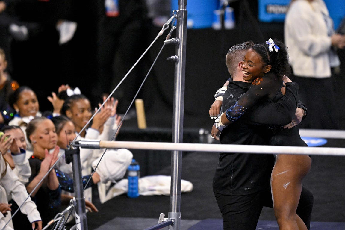 Moving photos capture triumph and heartbreak during women's gymnastics semifinal