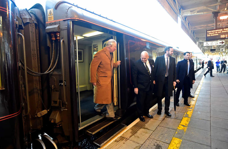 They travel by train They pack their own blood, Extremely tight schedule, Everything's prearranged, They travel by train, Greetings in several languages, They always pack a black outfit, Immigration, Heirs never travel together, Their luggage is tagged, A small army of employees, Identical outfits, Always dressed to the nines, Budgetary concerns, No private jets