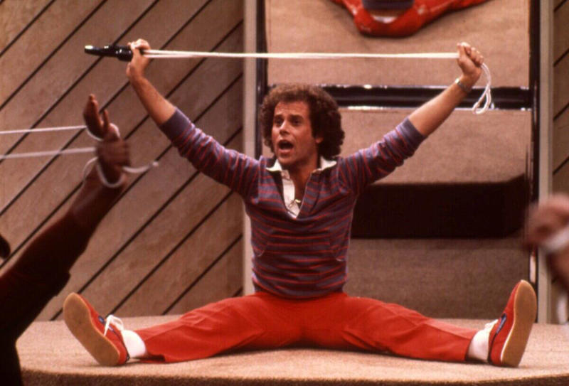 Athletic Tops And Tanks Vivid Colors, Early Hip Hop Styles, Big Hair, The Post-punk Aesthetic, Turtlenecks, Friends Wearing Matching Outfits, The Jazzercise Look, Shoulder Pads Fit For Linebackers, Jeans And Pants With High Waistlines, Stark Black and White, Short Shorts, Tights And Leotards, Streamlined Athletic Attire, Off-The-Shoulders Tops, Leggings For Aerobics And Style, Spiky Women's Hair, Sequinned Wardrobes, Tassels On Everything, The New York Aesthetic, T-Shirts With Graphics, Gigantic Sunglasses, Big Hair and Pastels, Fashion Gloves, Leather Dresses, Louis Vuitton Jackets And Accessories, Pop Music Went Punk, Cowboy Boots Worn Off The Ranch, Lingerie Worn As Part Of An Outfit, Gawdy Pearls And Jewelry, Real And Faux Feathers, Pouffy and Puffy Accessories, 2-Piece Skirt Suits, Preppy Dressing, Thick Belts With Mini Skirts, Double Blue Denim Outfits, High Top Sneakers And Thick Socks, Acid-Wash Jeans, Fingerless Neon Gloves, Scrunchies, Oversized Earrings In Bright Neon Colors, Ripped Knees On Jeans And Pants, Athletic Tops And Tanks, Knee-High Socks, Ankle Boots, Overalls, Track Suits And Windbreakers