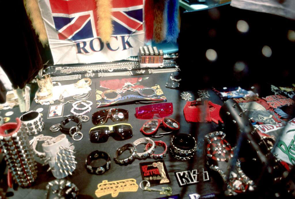Gawdy Pearls And Jewelry Vivid Colors, Early Hip Hop Styles, Big Hair, The Post-punk Aesthetic, Turtlenecks, Friends Wearing Matching Outfits, The Jazzercise Look, Shoulder Pads Fit For Linebackers, Jeans And Pants With High Waistlines, Stark Black and White, Short Shorts, Tights And Leotards, Streamlined Athletic Attire, Off-The-Shoulders Tops, Leggings For Aerobics And Style, Spiky Women's Hair, Sequinned Wardrobes, Tassels On Everything, The New York Aesthetic, T-Shirts With Graphics, Gigantic Sunglasses, Big Hair and Pastels, Fashion Gloves, Leather Dresses, Louis Vuitton Jackets And Accessories, Pop Music Went Punk, Cowboy Boots Worn Off The Ranch, Lingerie Worn As Part Of An Outfit, Gawdy Pearls And Jewelry, Real And Faux Feathers, Pouffy and Puffy Accessories, 2-Piece Skirt Suits, Preppy Dressing, Thick Belts With Mini Skirts, Double Blue Denim Outfits, High Top Sneakers And Thick Socks, Acid-Wash Jeans, Fingerless Neon Gloves, Scrunchies, Oversized Earrings In Bright Neon Colors, Ripped Knees On Jeans And Pants, Athletic Tops And Tanks, Knee-High Socks, Ankle Boots, Overalls, Track Suits And Windbreakers
