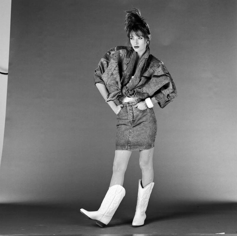 Cowboy Boots Worn Off The Ranch Vivid Colors, Early Hip Hop Styles, Big Hair, The Post-punk Aesthetic, Turtlenecks, Friends Wearing Matching Outfits, The Jazzercise Look, Shoulder Pads Fit For Linebackers, Jeans And Pants With High Waistlines, Stark Black and White, Short Shorts, Tights And Leotards, Streamlined Athletic Attire, Off-The-Shoulders Tops, Leggings For Aerobics And Style, Spiky Women's Hair, Sequinned Wardrobes, Tassels On Everything, The New York Aesthetic, T-Shirts With Graphics, Gigantic Sunglasses, Big Hair and Pastels, Fashion Gloves, Leather Dresses, Louis Vuitton Jackets And Accessories, Pop Music Went Punk, Cowboy Boots Worn Off The Ranch, Lingerie Worn As Part Of An Outfit, Gawdy Pearls And Jewelry, Real And Faux Feathers, Pouffy and Puffy Accessories, 2-Piece Skirt Suits, Preppy Dressing, Thick Belts With Mini Skirts, Double Blue Denim Outfits, High Top Sneakers And Thick Socks, Acid-Wash Jeans, Fingerless Neon Gloves, Scrunchies, Oversized Earrings In Bright Neon Colors, Ripped Knees On Jeans And Pants, Athletic Tops And Tanks, Knee-High Socks, Ankle Boots, Overalls, Track Suits And Windbreakers