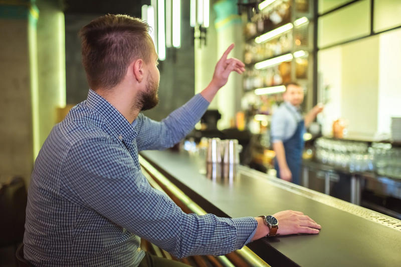 The dos and don’ts of bar etiquette, Asking them to do a shot with you, Picking up your drink before they give it to you, Cleaning up broken glass, Itemizing and splitting a tab, Stuffing napkins, straw wrappers or other trash into your cup, Telling them your life story, Asking them out, Reaching over or behind the bar to grab something quickly, Buying a round of drinks, Asking them to “surprise you” with a drink, Requesting a custom cocktail or ordering off-menu, Using beverage napkins to clean up a spill, Handing them a wad of cash, Getting creative with the tip, Not bothering them with safety concerns, Keeping things simple without a menu, About the experts, Why trust us