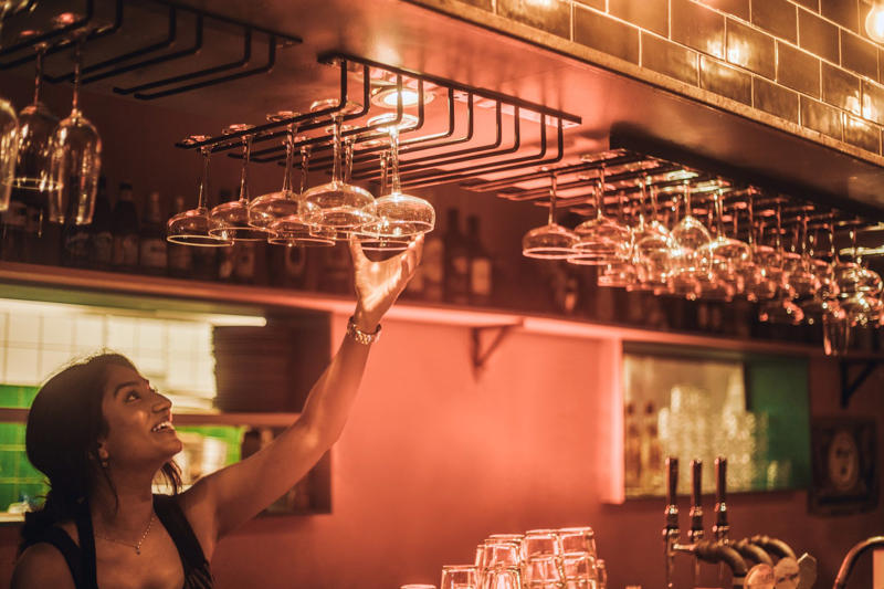The dos and don’ts of bar etiquette, Asking them to do a shot with you, Picking up your drink before they give it to you, Cleaning up broken glass, Itemizing and splitting a tab, Stuffing napkins, straw wrappers or other trash into your cup, Telling them your life story, Asking them out, Reaching over or behind the bar to grab something quickly, Buying a round of drinks, Asking them to “surprise you” with a drink, Requesting a custom cocktail or ordering off-menu, Using beverage napkins to clean up a spill, Handing them a wad of cash, Getting creative with the tip, Not bothering them with safety concerns, Keeping things simple without a menu, About the experts, Why trust us