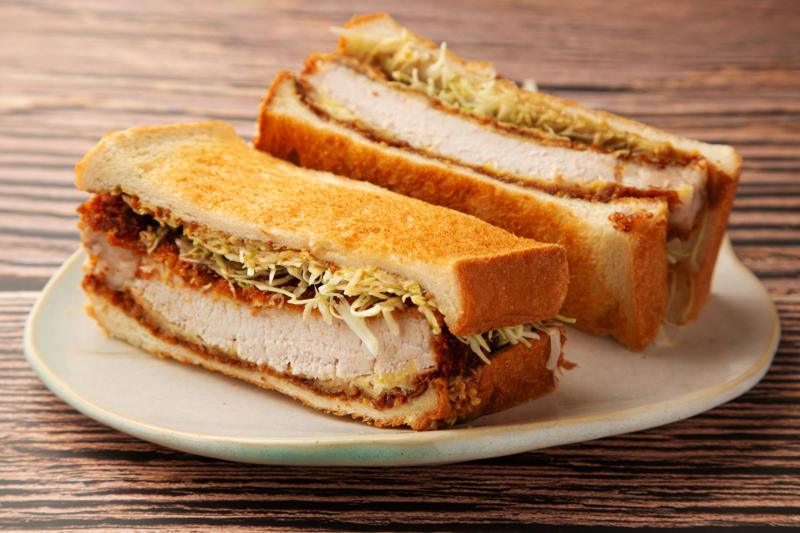 Katsu sando, Japan Vegemite, Australia, Yakisoba-pan, Japan, Roti john, Malaysia/Singapore, Vada pav, India, Breakfast roll, Ireland, Kaya toast, Singapore, Francesinha, Portugal, Bocadillo, Spain, Zapiekanka, Poland, Katsu sando, Japan, Cemita, Mexico, Bauru, Brazil, Rarebit, Wales, Leberkäsesemmel, Germany, Bánh mì, Vietnam, Jambon-beurre, France, Falafel, across the Middle East, Arepa, Venezuela, Montreal-style smoked meat, Canada, Pork chop bun, Macau, Tripleta, Puerto Rico, Chivito, Uruguay, Medianoche, Cuba, Chopped barbecue, USA, Gyro, Greece