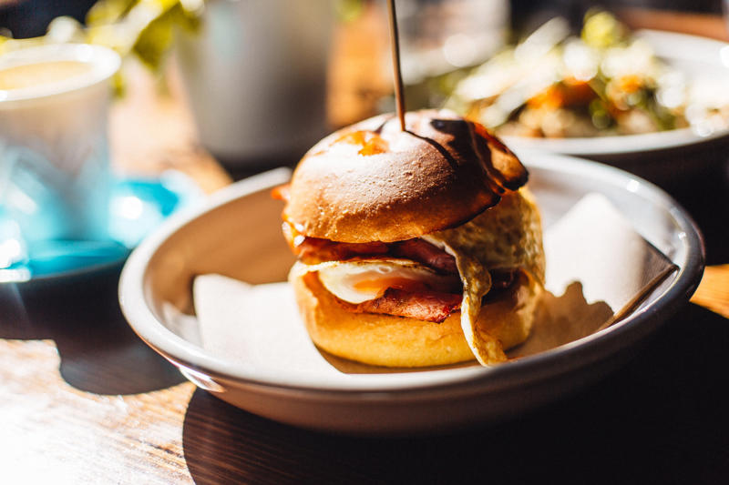 Breakfast roll, Ireland Vegemite, Australia, Yakisoba-pan, Japan, Roti john, Malaysia/Singapore, Vada pav, India, Breakfast roll, Ireland, Kaya toast, Singapore, Francesinha, Portugal, Bocadillo, Spain, Zapiekanka, Poland, Katsu sando, Japan, Cemita, Mexico, Bauru, Brazil, Rarebit, Wales, Leberkäsesemmel, Germany, Bánh mì, Vietnam, Jambon-beurre, France, Falafel, across the Middle East, Arepa, Venezuela, Montreal-style smoked meat, Canada, Pork chop bun, Macau, Tripleta, Puerto Rico, Chivito, Uruguay, Medianoche, Cuba, Chopped barbecue, USA, Gyro, Greece