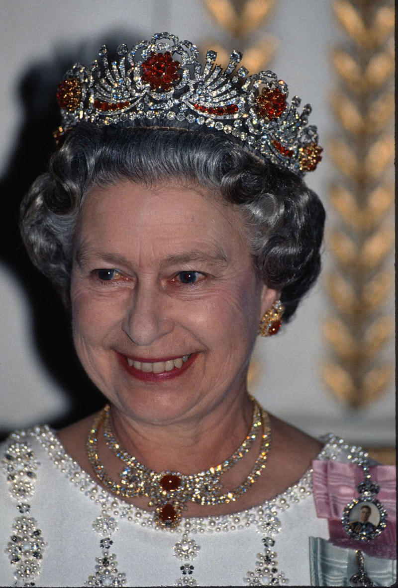 The Burmese Ruby tiara The Cambridge Lover's Knot, The Cartier Halo Scroll tiara, The Queen Mary Diamond Bandeau tiara, The George IV State Diadem crown, Girls of Great Britain and Ireland tiara, The Poltimore tiara, The Queen Mary Fringe tiara, The Strathmore Rose tiara, The Oriental Circlet tiara, The York tiara, The Delhi Durbar tiara, The Cubitt-Shand tiara, Princess Alice's Meander tiara, Cambridge Lover's Knot tiara, Queen Alexandra's Kokoshnik tiara, The Burmese Ruby tiara, Brazilian Aquamarine Parure tiara, earrings, and necklace, The Belgium Sapphire tiara, earrings, and necklace, Meghan Markle's engagement ring, "Granny's Chips", The Delhi Durbar necklace