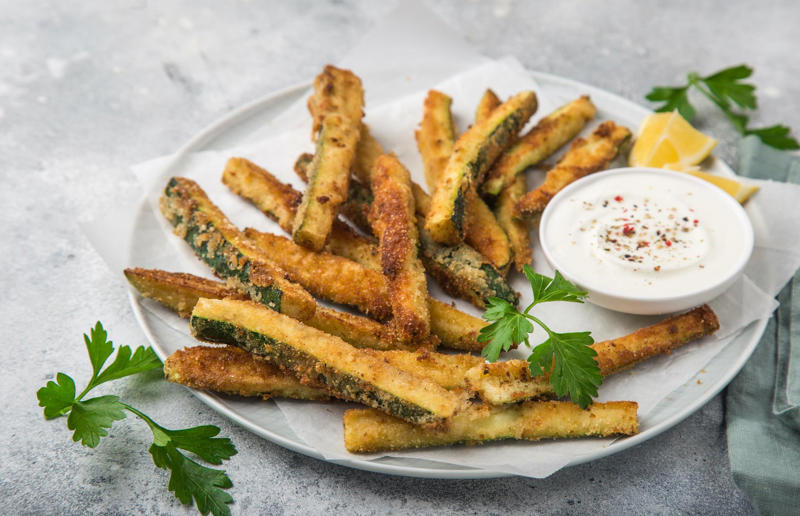 Courgette fries Single servings, Roasted butternut squash soup, Courgette fries, Mushrooms on toast, Miso-glazed aubergine, Crispy tofu salad, Roasted salmon with asparagus, Garlicky pork chop with potato wedges, Baked fish, Prosciutto-wrapped chicken, Halloumi burger, Lamb cutlets with feta, herbs and chilli, Chicken wings with firecracker dipping sauce, Falafel salad with hummus, Salmon tacos, Fish and chips, Spaghetti and meatballs, Loaded jacket potatoes, Fish cakes, Creamy baked eggs