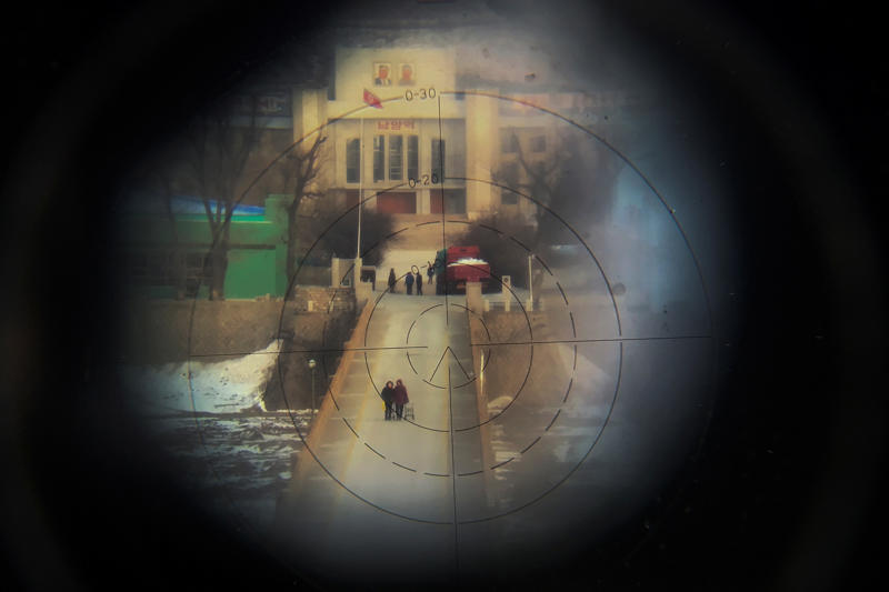 Double vision, A bridge once crossed, Always observed, Working in wet, freezing conditions, Looking for something precious, Strolling through Hyesan, Postcard from North Korea, Treading water, Basic laundry duties, A selfie on the North Korean border, Little activity in a small village, Fishermen being watched, Look at him looking at you, Under constant observation, Alone by the river, Under Chinese scrutiny, A cold journey home, Catch of the day!