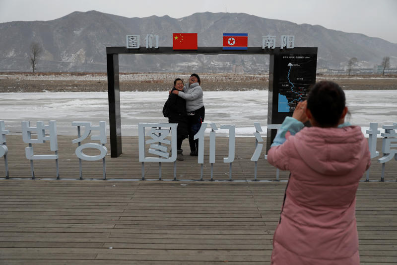 Double vision, A bridge once crossed, Always observed, Working in wet, freezing conditions, Looking for something precious, Strolling through Hyesan, Postcard from North Korea, Treading water, Basic laundry duties, A selfie on the North Korean border, Little activity in a small village, Fishermen being watched, Look at him looking at you, Under constant observation, Alone by the river, Under Chinese scrutiny, A cold journey home, Catch of the day!