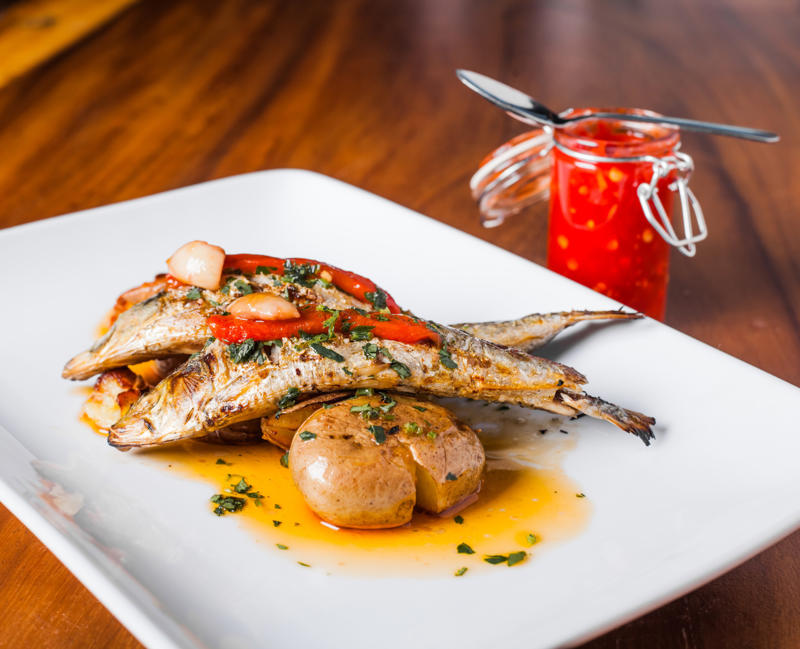 Grilled sardines, Portugal Fish and chips, England, Tequeños, Venezuela, Spanish tortilla, Spain, Gyros, Greece, Spring rolls, China, Falafel, Egypt, Cordon bleu, Switzerland, Chivito, Uruguay, Samosa, India, Boxty, Ireland, Pirozhki, Russia, Bobotie, South Africa, Tostones, Dominican Republic, Choripán, Argentina, Grilled sardines, Portugal, Rice and beans, Brazil