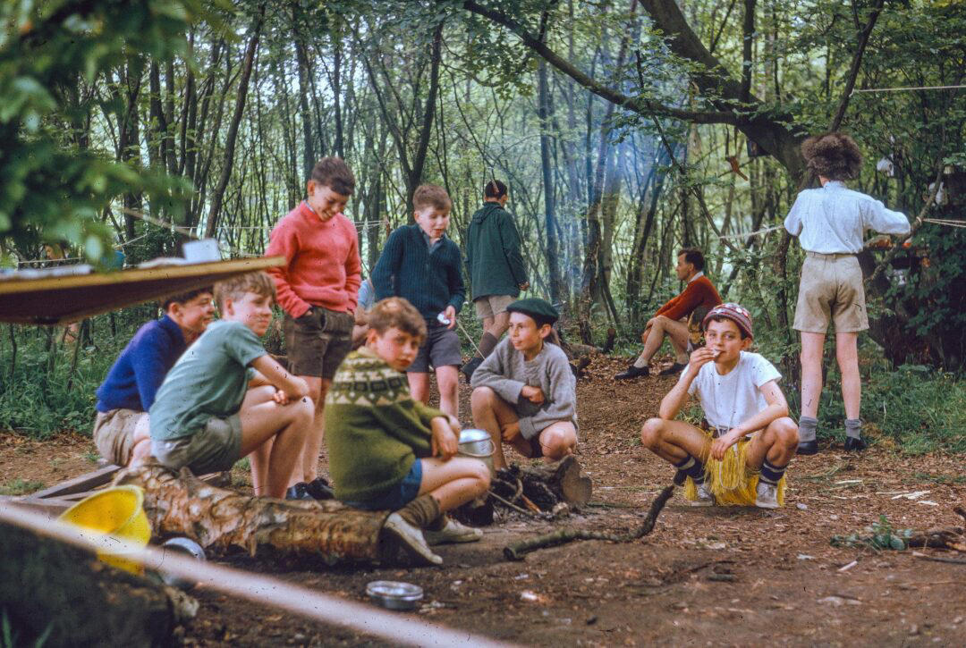 17. Boys Camping in the ’60s 1. Boys Setting Up Their Train Model (1946), 2. Dangerous Curves (1949), 3. Before Prom (1967), 4. Going for a Ride in the Convertible (1957), 5. Enjoying a Day at the Public Pool (1960s), 6. Mespelbrunn Castle in Bavaria, Germany, 7. Diving Contest in Palm Beach, Florida (1959), 8. Waiting on a Prom Date (1950s), 9. A Husband’s Portrait of His Wife (1954), 10. Times Square (1959), 11. Little Girl Fishing on the North Shore of Oahu (1960), 12. Couple on Vacation in Florida (1950s), 13. A Baker and His Bread (1950s), 14. Kids Posing by Their Family Vehicle (1966), 15. Brothers Playing in the Snow (1963), 16. Dogs Like Rides Too (1962), 17. Orphan Children from Mooseheart, Illinois (1948), 18. Stopping at Texaco on a Road Trip (1958), 19. Toddler Walking Around in Flowers (1954), 20. Boys on a Camping Trip (1965), 21. Saying Goodbye to Grandma (1950), 22. Picnic in France (1969), 23. A Night at the Bar (1950s), 24. Typical Teen Party (1978)
