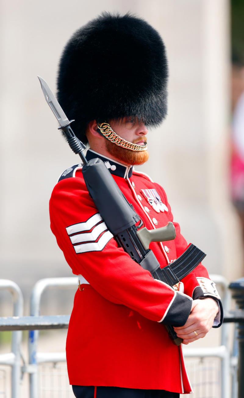 They need to pass an exam They’re part of British history, They need to be tall, They need to pass an exam, They go through a demanding training program, Remuneration package, They are early birds, They have to be resilient, Their hats are old, big, and heavy, They wear their hats in a peculiar way, Their uniforms must be in top-notch condition at all times, They may faint, Hot weather can be a nightmare, They can still serve their country in military operations, They might chat with members of the royal family