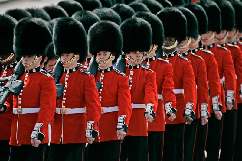 Remuneration package They’re part of British history, They need to be tall, They need to pass an exam, They go through a demanding training program, Remuneration package, They are early birds, They have to be resilient, Their hats are old, big, and heavy, They wear their hats in a peculiar way, Their uniforms must be in top-notch condition at all times, They may faint, Hot weather can be a nightmare, They can still serve their country in military operations, They might chat with members of the royal family