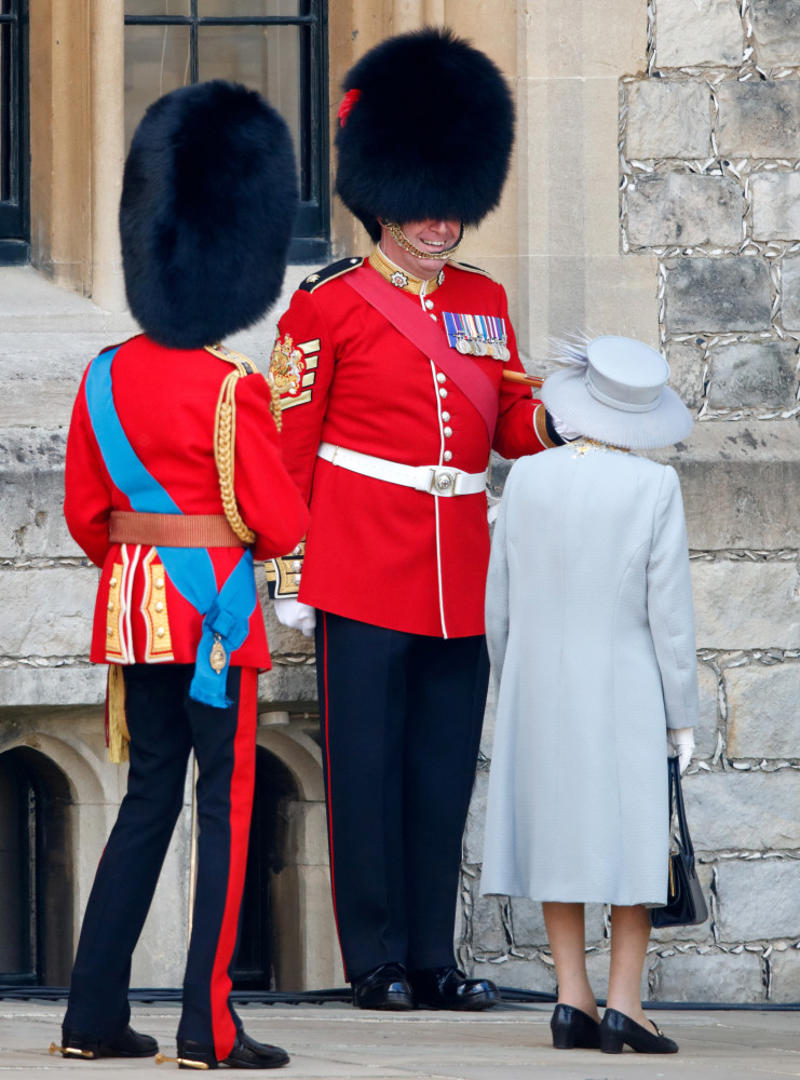 They might chat with members of the royal family They’re part of British history, They need to be tall, They need to pass an exam, They go through a demanding training program, Remuneration package, They are early birds, They have to be resilient, Their hats are old, big, and heavy, They wear their hats in a peculiar way, Their uniforms must be in top-notch condition at all times, They may faint, Hot weather can be a nightmare, They can still serve their country in military operations, They might chat with members of the royal family