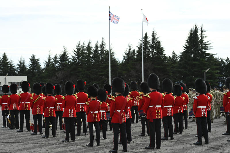 They go through a demanding training program They’re part of British history, They need to be tall, They need to pass an exam, They go through a demanding training program, Remuneration package, They are early birds, They have to be resilient, Their hats are old, big, and heavy, They wear their hats in a peculiar way, Their uniforms must be in top-notch condition at all times, They may faint, Hot weather can be a nightmare, They can still serve their country in military operations, They might chat with members of the royal family
