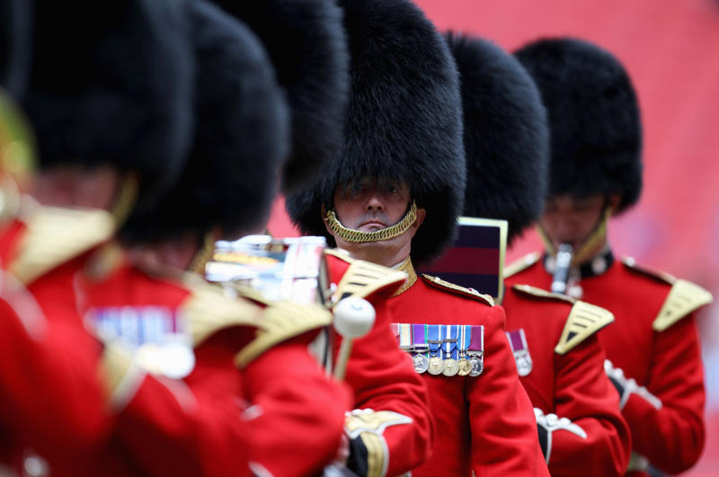 Their uniforms must be in top-notch condition at all times They’re part of British history, They need to be tall, They need to pass an exam, They go through a demanding training program, Remuneration package, They are early birds, They have to be resilient, Their hats are old, big, and heavy, They wear their hats in a peculiar way, Their uniforms must be in top-notch condition at all times, They may faint, Hot weather can be a nightmare, They can still serve their country in military operations, They might chat with members of the royal family