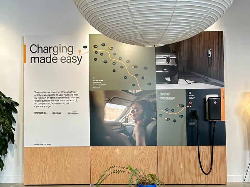 The posters were informative and accessible. They explained what EV ownership is like and what the brand offers. It had two EVs featured in the store., Rivian had Boxed Water in a basket at the door., The decor was colorful, outdoorsy, and relaxed., A Rivian spokesperson told me that the store is designed for families., The store had a merchandise section with locally sourced reusable bags, A Rivian employee took me on a test drive., I didn't see too many customers during my visit., I went to Tesla's showroom in the Meatpacking District the next day., The store's design was tech-forward, sleek, and futuristic., Tesla had some interactive elements in the space., The wall posters were more show than tell., The space also showed off Tesla's tech., Tesla's Optimus humanoid robot was on display., The staff seemed used to tourists popping in and taking photos., I was offered an espresso while I waited for my test ride., To sum it up: I enjoyed both experiences.