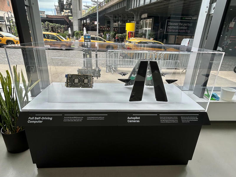 The space also showed off Tesla's tech. It had two EVs featured in the store., Rivian had Boxed Water in a basket at the door., The decor was colorful, outdoorsy, and relaxed., A Rivian spokesperson told me that the store is designed for families., The store had a merchandise section with locally sourced reusable bags, A Rivian employee took me on a test drive., I didn't see too many customers during my visit., I went to Tesla's showroom in the Meatpacking District the next day., The store's design was tech-forward, sleek, and futuristic., Tesla had some interactive elements in the space., The wall posters were more show than tell., The space also showed off Tesla's tech., Tesla's Optimus humanoid robot was on display., The staff seemed used to tourists popping in and taking photos., I was offered an espresso while I waited for my test ride., To sum it up: I enjoyed both experiences.
