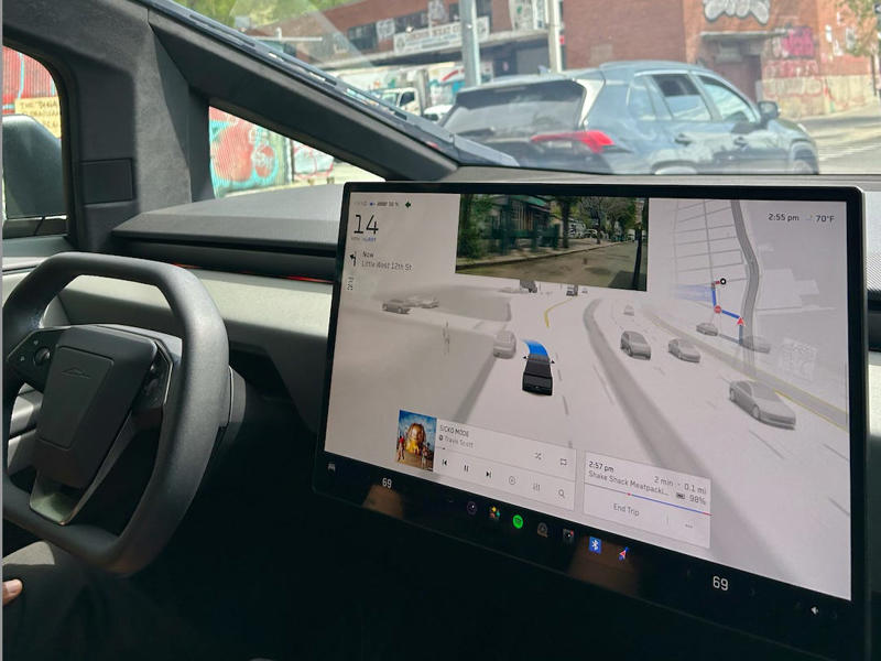 I rode in a Cybertruck. The test drive felt more like a tech demo, while Rivian was more focused on providing information. It had two EVs featured in the store., Rivian had Boxed Water in a basket at the door., The decor was colorful, outdoorsy, and relaxed., A Rivian spokesperson told me that the store is designed for families., The store had a merchandise section with locally sourced reusable bags, A Rivian employee took me on a test drive., I didn't see too many customers during my visit., I went to Tesla's showroom in the Meatpacking District the next day., The store's design was tech-forward, sleek, and futuristic., Tesla had some interactive elements in the space., The wall posters were more show than tell., The space also showed off Tesla's tech., Tesla's Optimus humanoid robot was on display., The staff seemed used to tourists popping in and taking photos., I was offered an espresso while I waited for my test ride., To sum it up: I enjoyed both experiences.