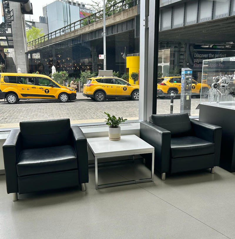 There were seating options, but it didn't have the same relaxed hangout vibe as Rivian. It had two EVs featured in the store., Rivian had Boxed Water in a basket at the door., The decor was colorful, outdoorsy, and relaxed., A Rivian spokesperson told me that the store is designed for families., The store had a merchandise section with locally sourced reusable bags, A Rivian employee took me on a test drive., I didn't see too many customers during my visit., I went to Tesla's showroom in the Meatpacking District the next day., The store's design was tech-forward, sleek, and futuristic., Tesla had some interactive elements in the space., The wall posters were more show than tell., The space also showed off Tesla's tech., Tesla's Optimus humanoid robot was on display., The staff seemed used to tourists popping in and taking photos., I was offered an espresso while I waited for my test ride., To sum it up: I enjoyed both experiences.