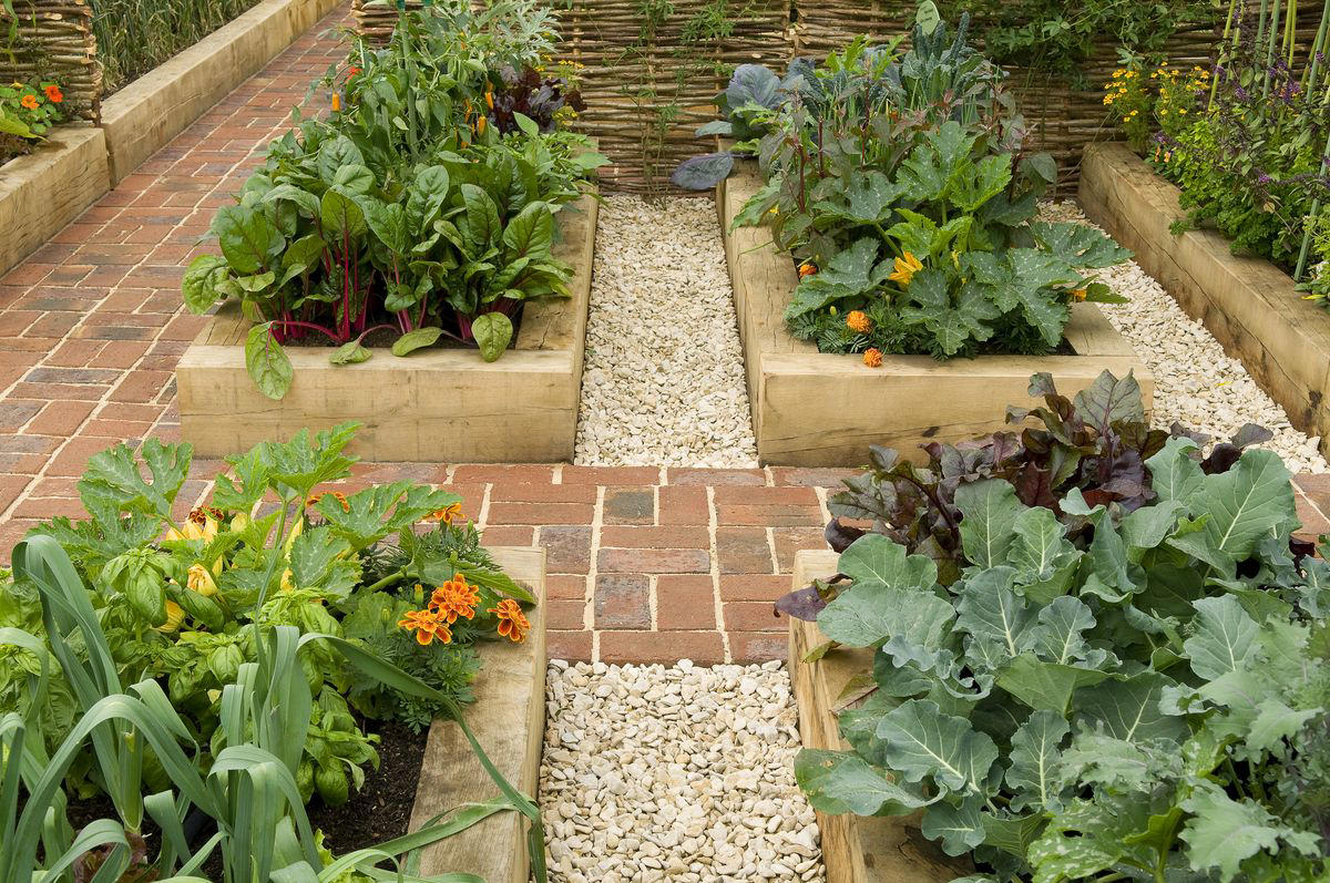 1) Make Them Waist Height, 3) Carve a Path, 4) Add Grid Wiring, 5) Use Brick, 10) Build in Steps, 11) Spring for Stone, 13) Choose Colorful Planters, 16) Make Your Own Meadow, 19) Opt for a Bucket, 20) Try Square Foot Gardening, 21) Surround a Shed, 22) Mix the Materials, 23) Work the Angles, 25) Tier the Planters, 26) Incorporate Scenic Pathways, 27) Mix and Match Your Vessels, 28) Think Outside the Box, 29) Automate Your Chores, 30) Add a Bit of Quirk