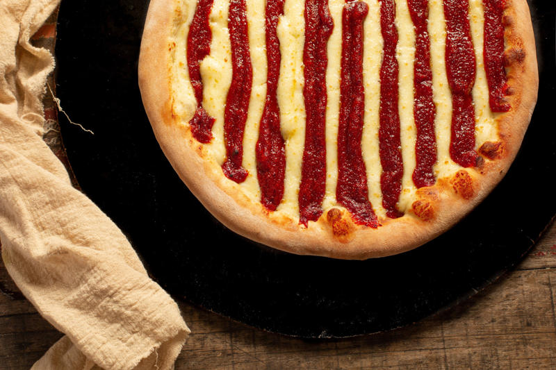 Where did pizza originate?, The first pizza topping, Pickle pizza, USA, Sardine pizza, Italy, Cheeseburger pizza, USA, Caviar pizza, Sweden, Chicken with Catupiry pizza, Brazil, Reindeer meat pizza, Finland, Romeo and Juliet, Brazil, Dessert pizzas, Brazil, Breakfast pizza, Australia, Green peas, Brazil, Squid pizza, Japan, Tandoori chicken pizza, India, Seafood pizza, Italy