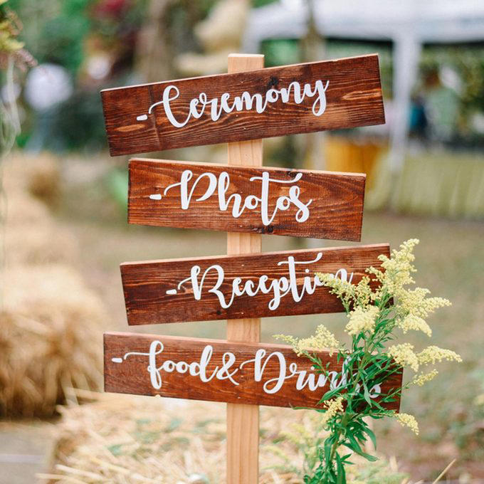 A Photo Journey of Your Story, Ample Outdoor Reception Lighting, Hang Chandeliers From Trees, Birdseed Confetti, DIY Photo Booth, Make Your Own Seating, Pallet Dance Floor, Succulent Wedding Gifts, DIY Wooden Wedding Arch, Tree Stump Centerpieces, Whimsical Light Bulbs Flower Holders, Lawn Games, Wooden Direction Signs, Use What You Have, DIY Wedding Decorations Concrete Numbers or Letters, Accommodate for the Weather, Arbor Seating, Use Your Resources Wisely, Marquee Letters