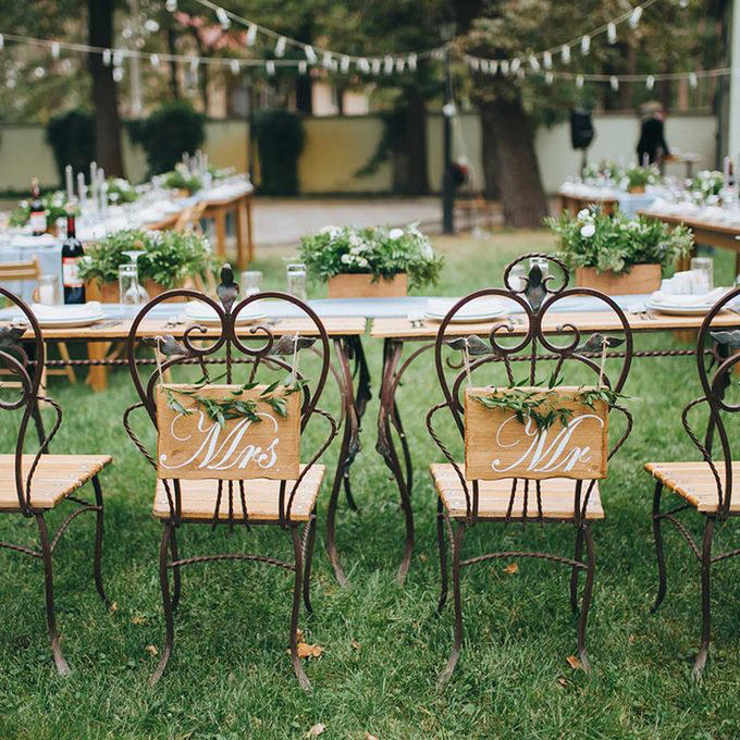 A Photo Journey of Your Story, Ample Outdoor Reception Lighting, Hang Chandeliers From Trees, Birdseed Confetti, DIY Photo Booth, Make Your Own Seating, Pallet Dance Floor, Succulent Wedding Gifts, DIY Wooden Wedding Arch, Tree Stump Centerpieces, Whimsical Light Bulbs Flower Holders, Lawn Games, Wooden Direction Signs, Use What You Have, DIY Wedding Decorations Concrete Numbers or Letters, Accommodate for the Weather, Arbor Seating, Use Your Resources Wisely, Marquee Letters