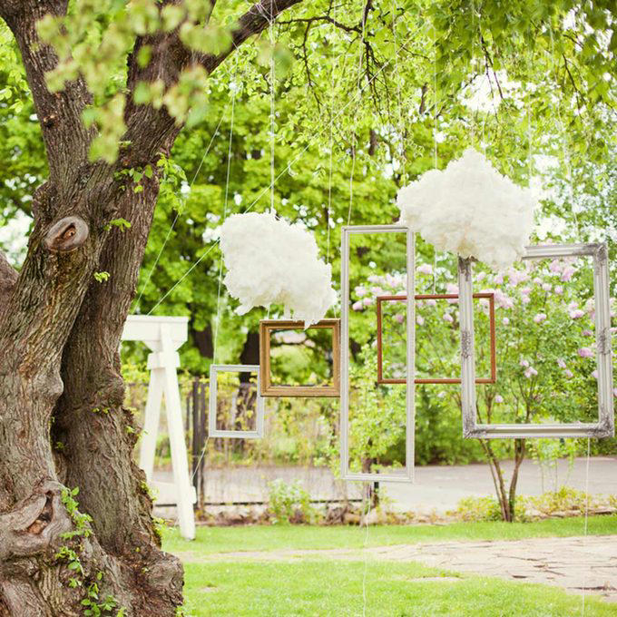 A Photo Journey of Your Story, Ample Outdoor Reception Lighting, Hang Chandeliers From Trees, Birdseed Confetti, DIY Photo Booth, Make Your Own Seating, Pallet Dance Floor, Succulent Wedding Gifts, DIY Wooden Wedding Arch, Tree Stump Centerpieces, Whimsical Light Bulbs Flower Holders, Lawn Games, Wooden Direction Signs, Use What You Have, DIY Wedding Decorations Concrete Numbers or Letters, Accommodate for the Weather, Arbor Seating, Use Your Resources Wisely, Marquee Letters