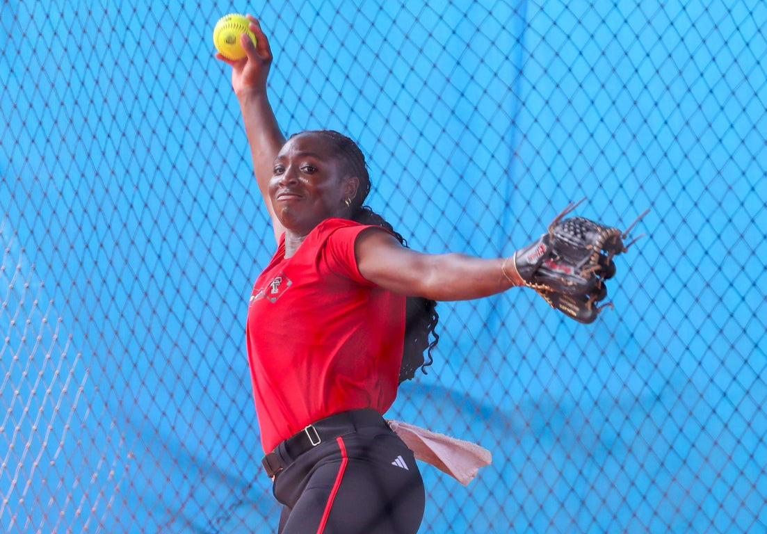 Elite softball teams practice ahead of the Women's College World Series, in photos
