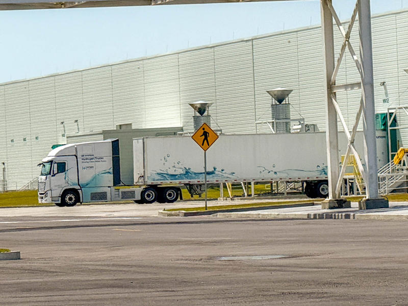 Here's a Hyundai XCIENT hydrogen fuel cell semi truck used to transport parts and supplies to the factory. My tour began in the plant's modern main lobby., The Metaplant site consists of 11 buildings totalling 7.5 million square feet of space., Stamped parts are transported by automated guided vehicles, or AGVs., The stamped metal panels are then stored in these massive racks., Here are parts of the Ioniq 9, Hyundai's new flagship three-row EV SUV., The next part of the tour is the welding shop., The vehicles' interiors are then assembled by hand.